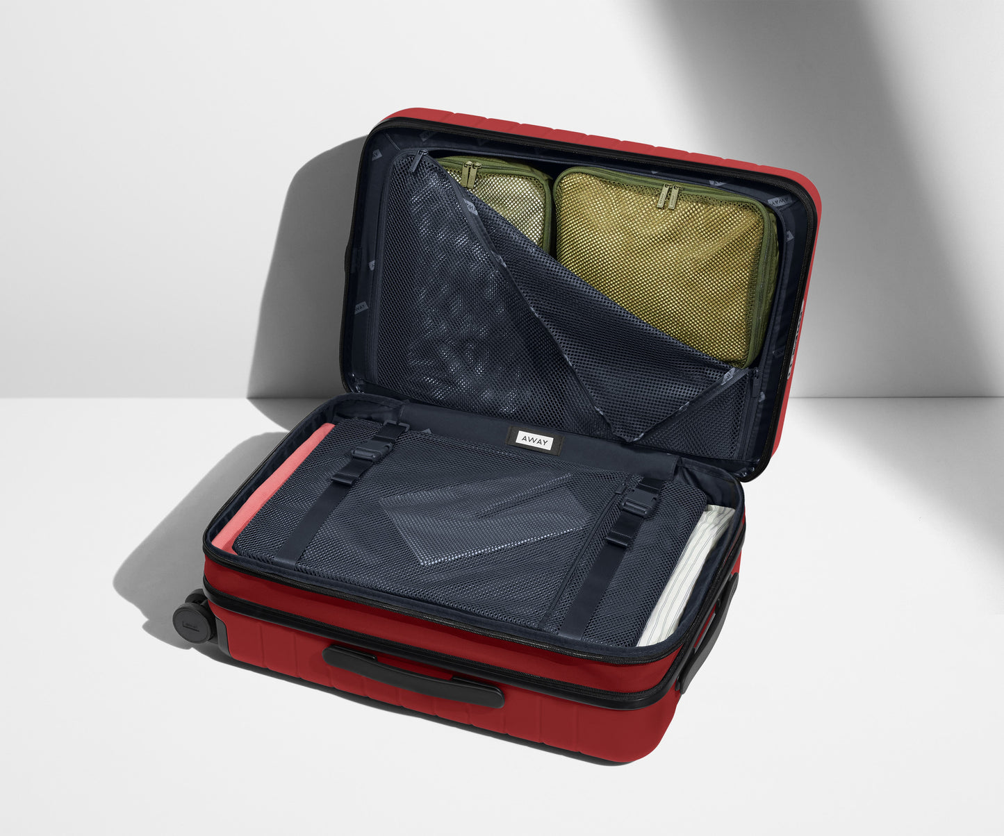 The Bigger Carry-On Flex in Tango Red