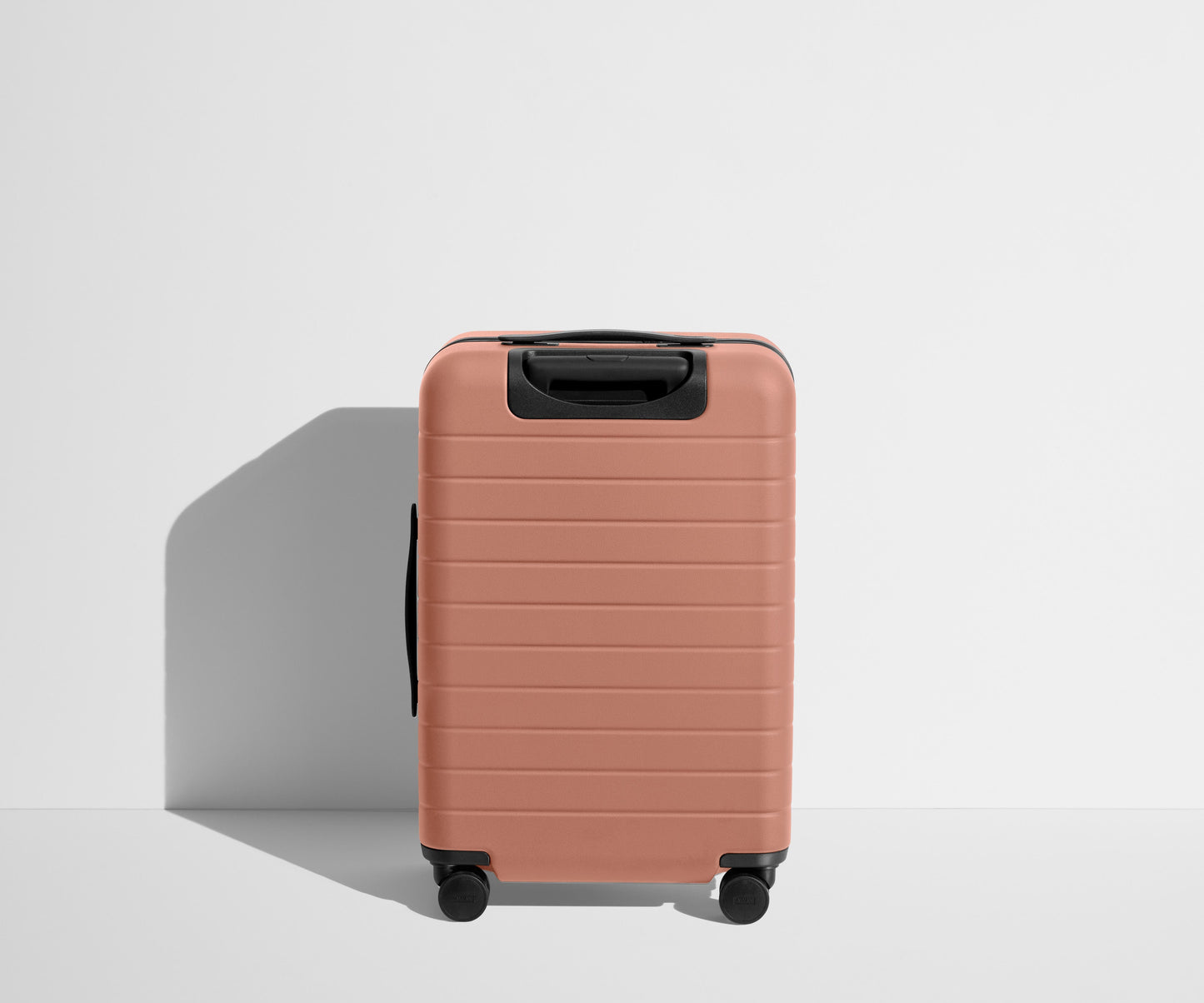 The Bigger Carry-On Flex in Clay Pink