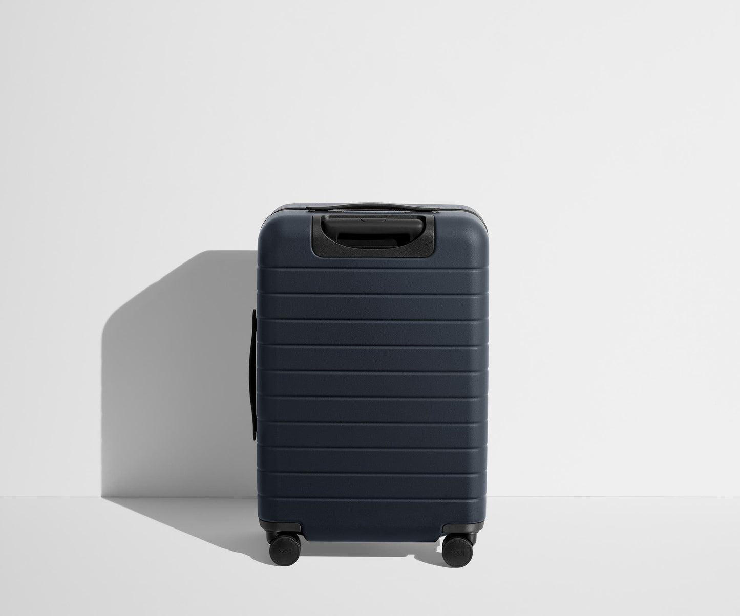 The Bigger Carry-On in Navy Blue