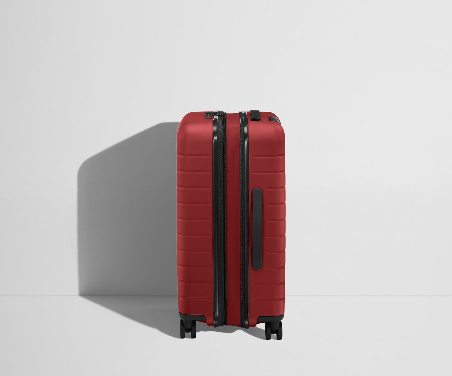 The Bigger Carry-On Flex in Tango Red