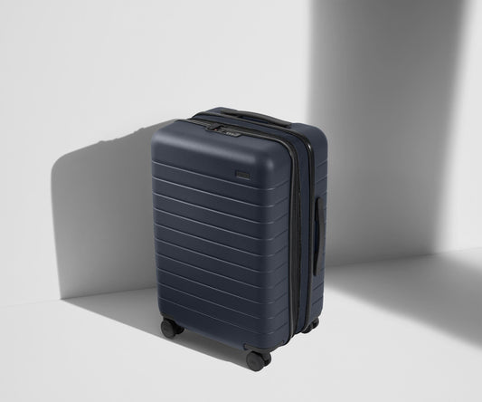 The Bigger Carry-On Flex in Navy Blue