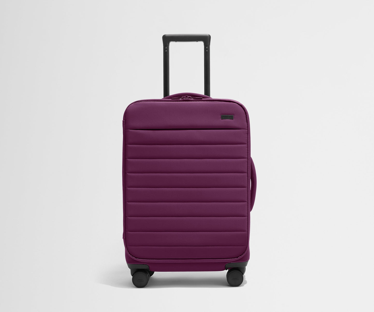 The Softside Bigger Carry-On in Plum Purple