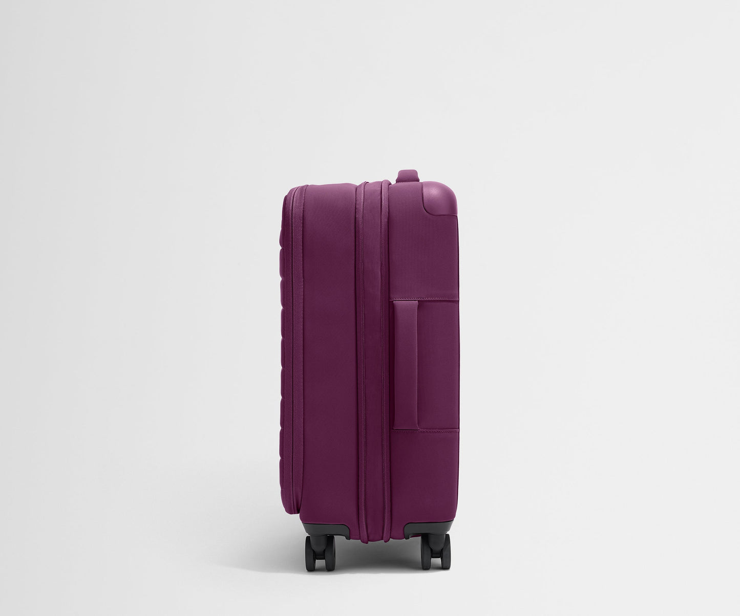 The Softside Bigger Carry-On in Plum Purple