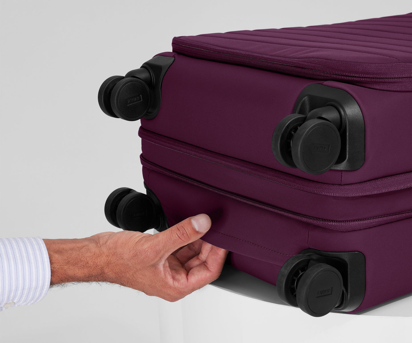 The Softside Bigger Carry-On in Plum Purple